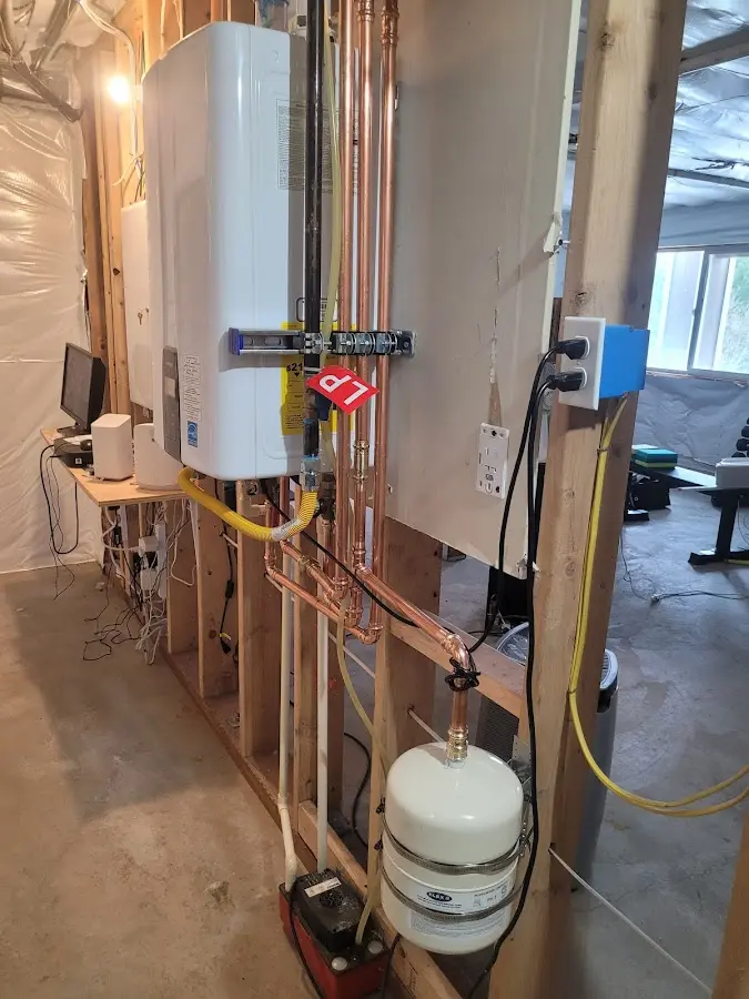 Licensed plumber repairing a kitchen sink in Bainbridge